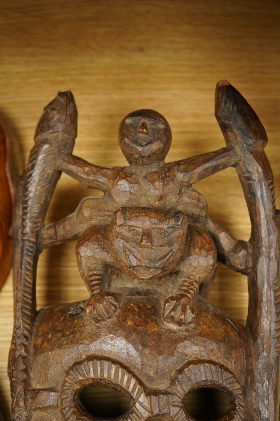 A collection of seven Nepalese, African and Indonesian masks to include a Magar example and one from the Dan Tribe, Liberia, largest 40cm